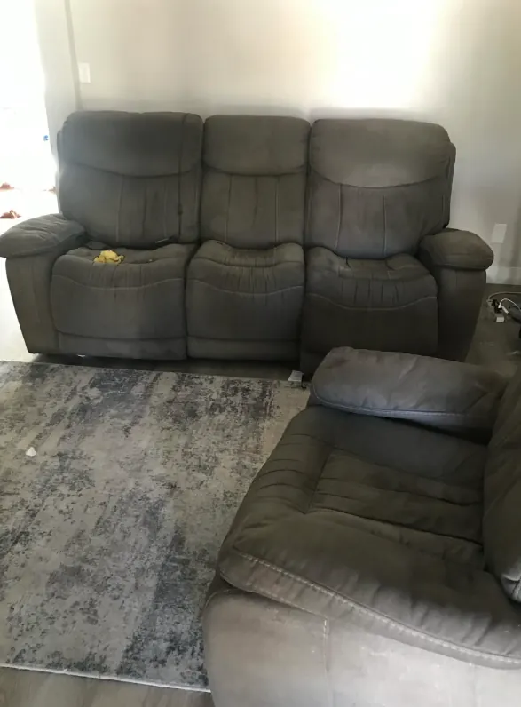 Reclining couch and chair inside a room