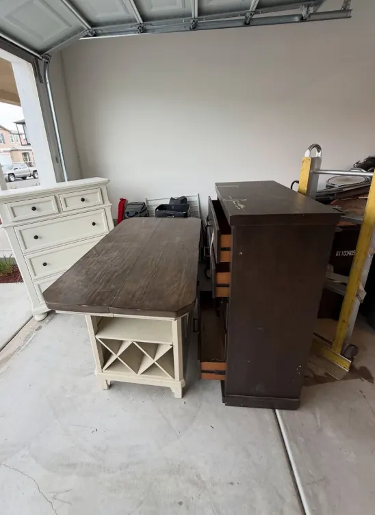 Dressers and other unwanted furniture in a garage